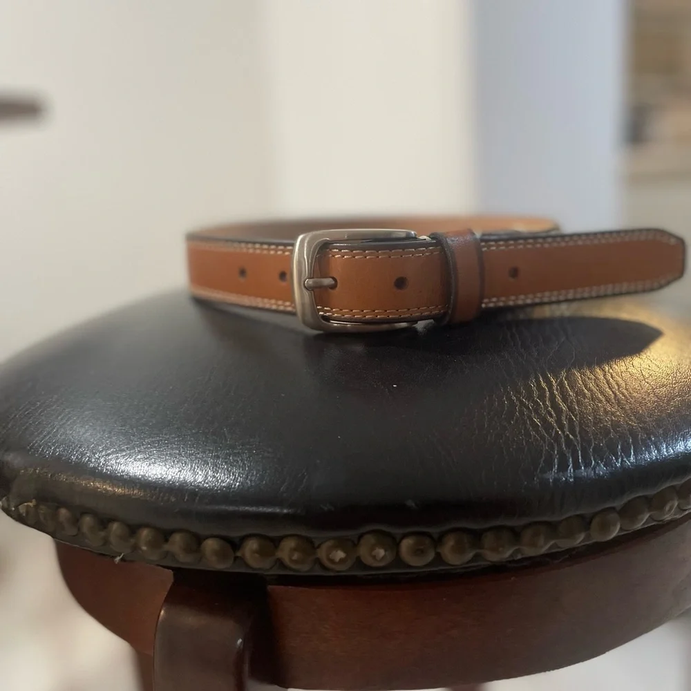 NWOT Genuine leather belt. 31” of leather end to end not including buckle.26/28